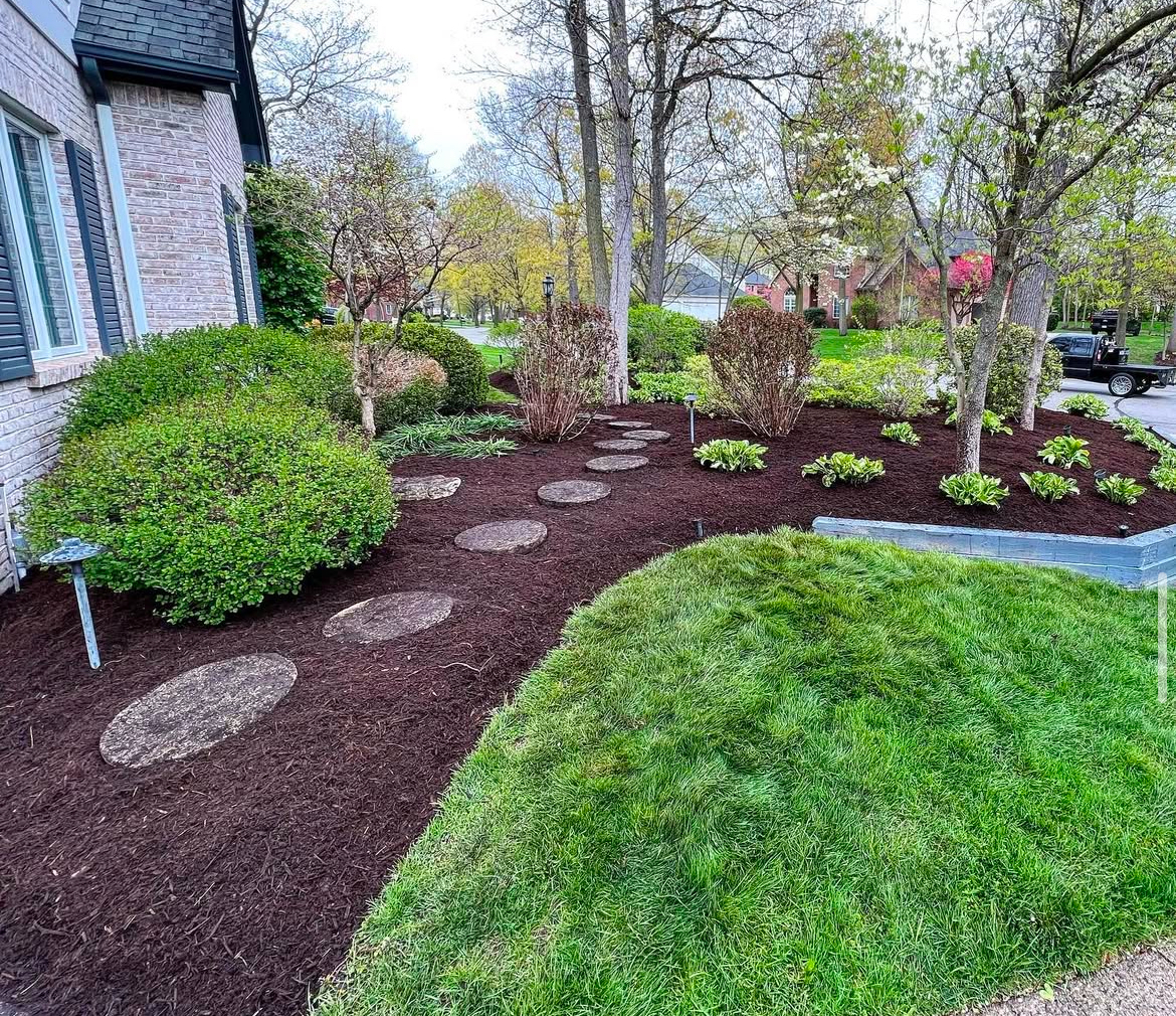 Clean landscaped bed with fresh mulch