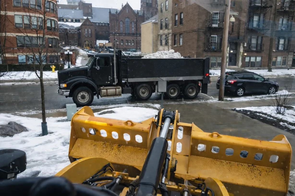 Fully cleared commercial parking lot after professional snow hauling and de-icing